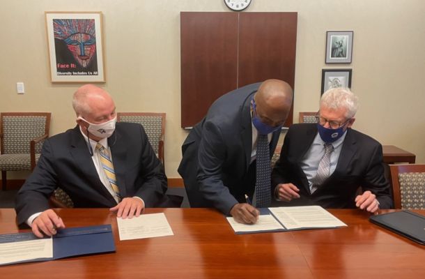 Dr. Terry Brown signs the Innovative Transfer Agreement